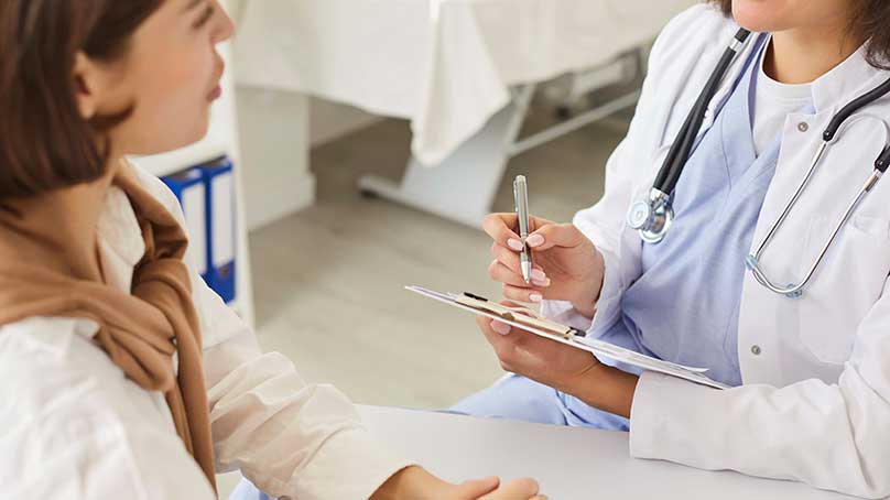 Doctor taking medical history and discussing treatment plan for varicose veins